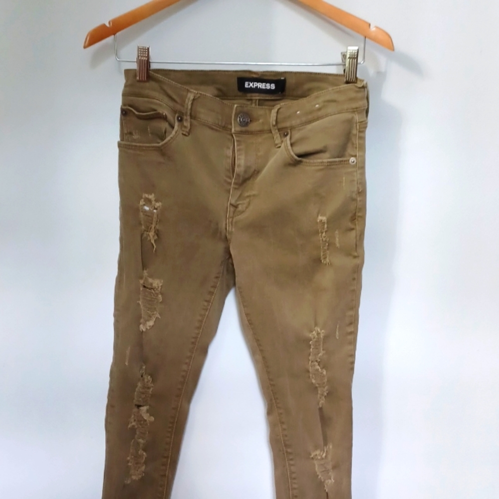 Express distresses frill bottom olive green jeans. Size 6.